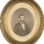 Oval portrait photograph Inscribed and Signed, Showing a Bearded Lincoln